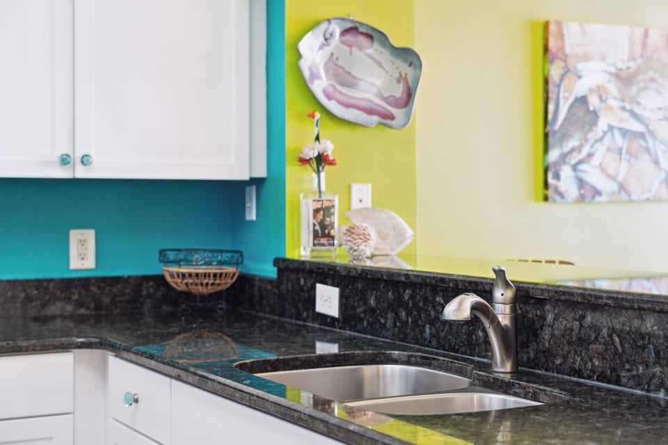 Fully equipped kitchen, overlooks the dining room and living room.