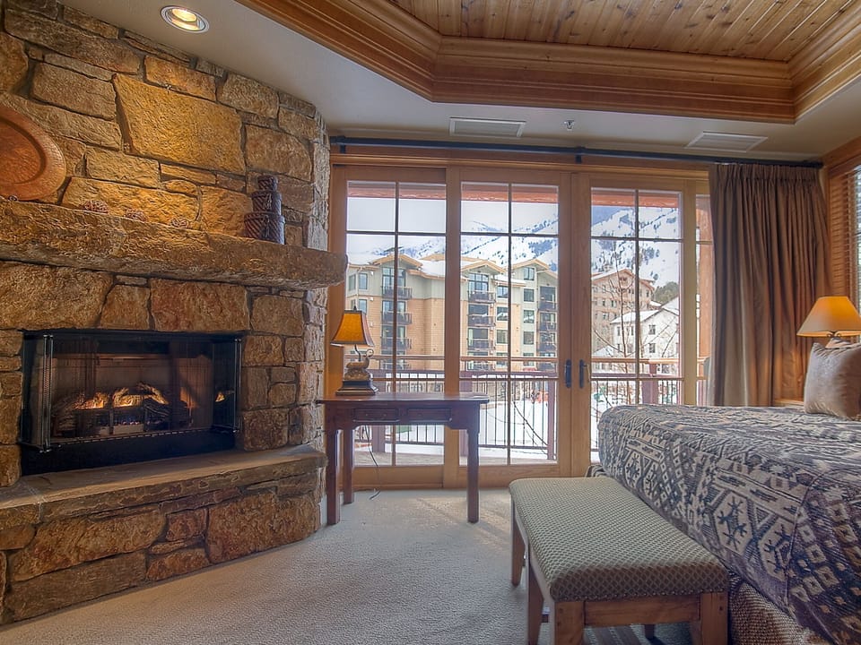 Enjoy personal fireplace and furnished private balcony overlooking Teton Commons