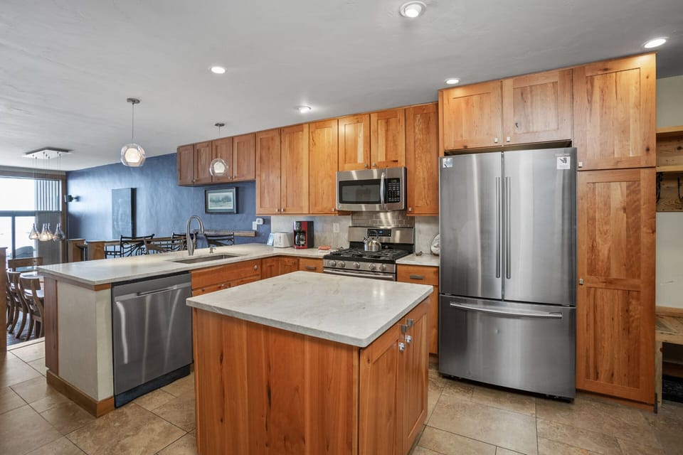 A large island in a kitchen with great flow