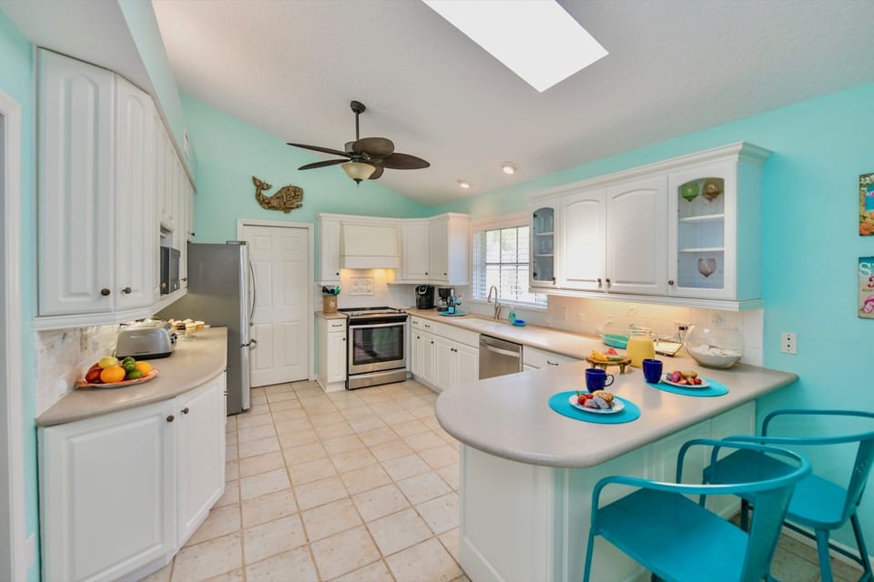 Tropical Chef's Kitchen with Seating for 2 at Bar, New Stainless Appliances