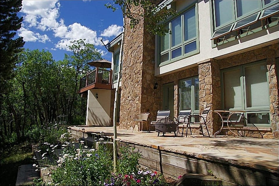 Lower Patio with Outdoor Fireplace & Gardens