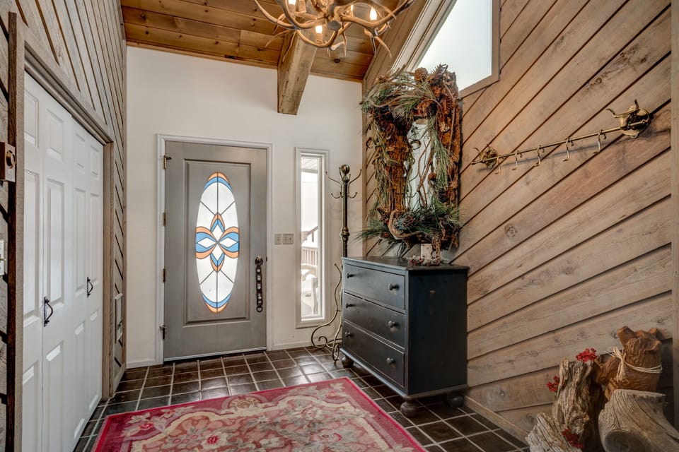 Foyer with Coat Hooks and a Double Closet