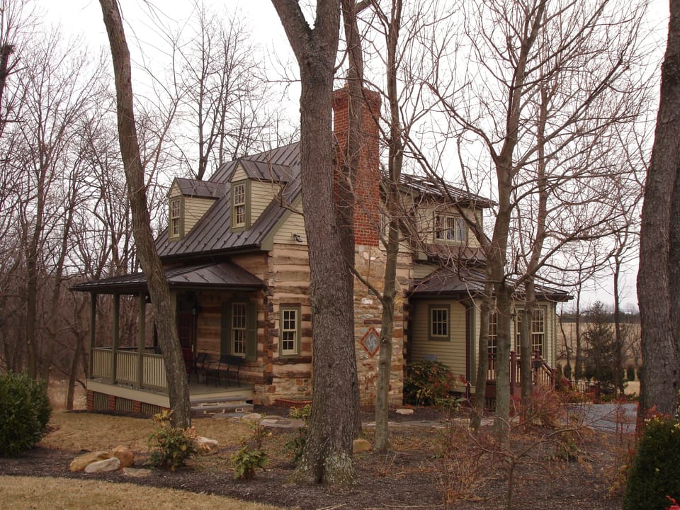 Southwest corner/Winter/with front setting porch and massive chimney