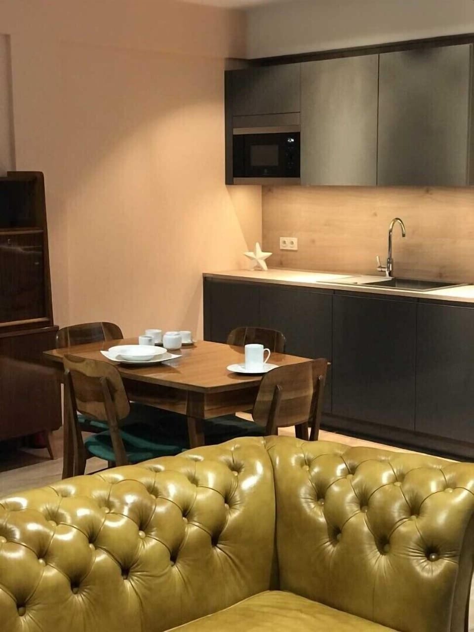 Microwave and dishwasher on the second plan.