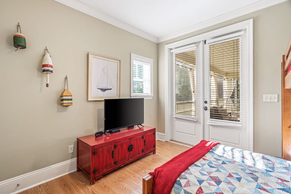 2nd Floor Bunk Room (1 Full & 1 Twin) shares a hallway bathroom with the additional King bedroom.  This room has access to the spacious screened-in balcony