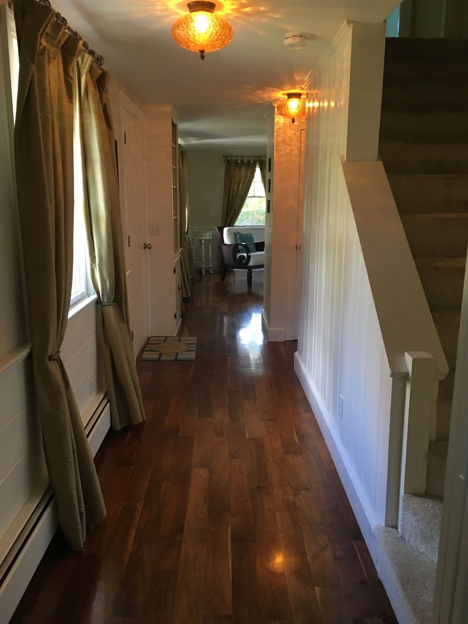 Entry Hall with Stairs to Upper Level, and looking towards family room/lounge