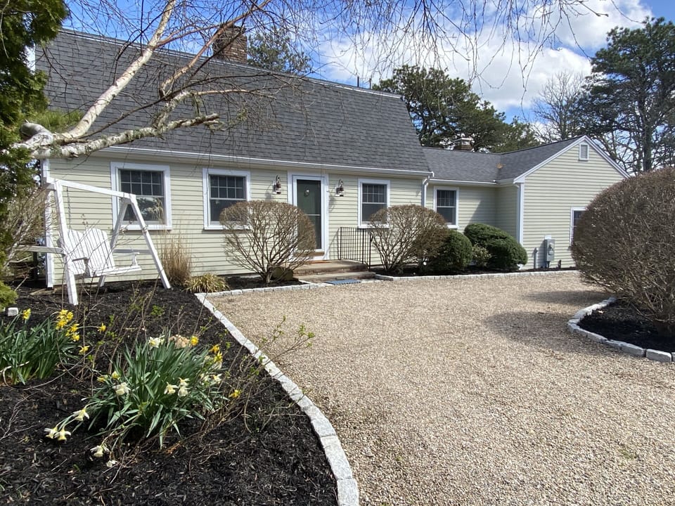 Front of house with swing, ample parking and circular drive