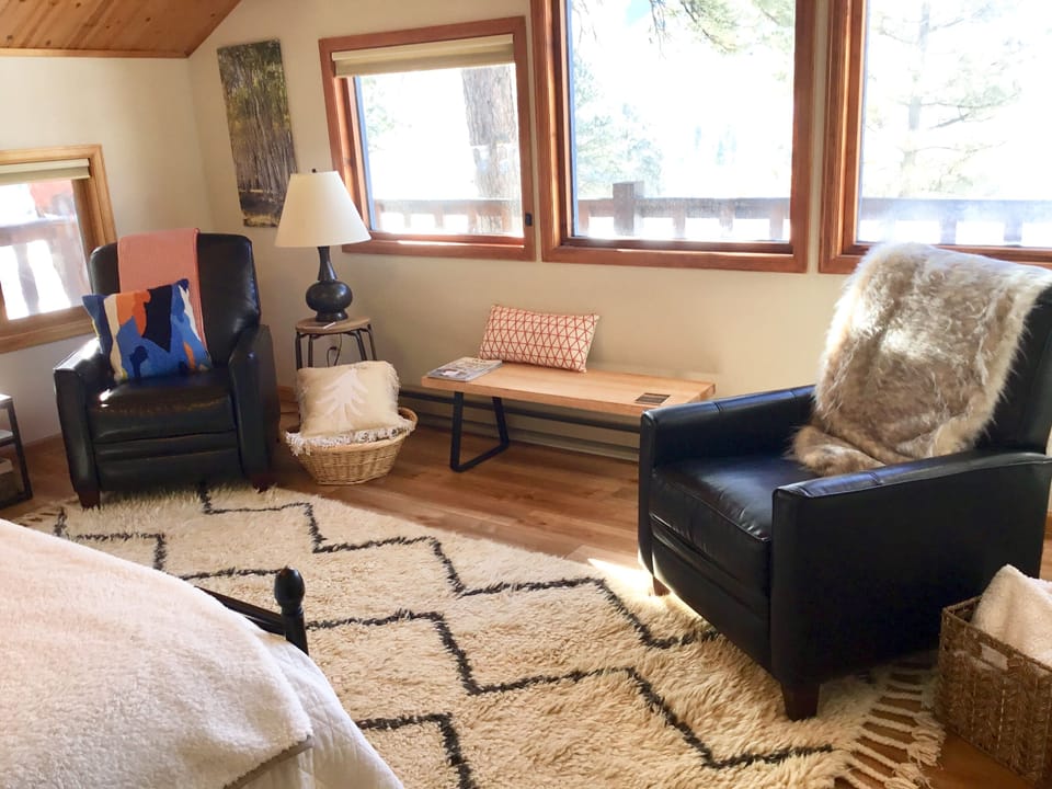 Large master living area with 2 recliners for reading, napping or watching tv. 