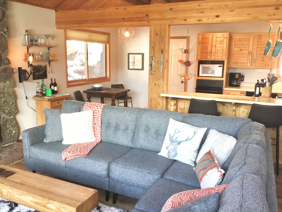 Open beamed living area perfect for casual conversation and entertaining. 