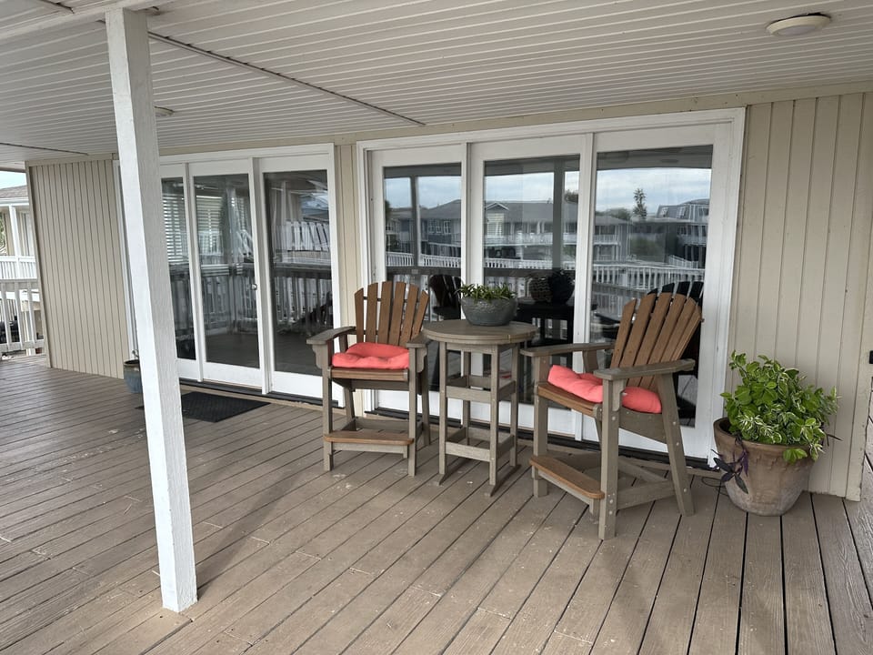 Front door to the house on the main level with the sitting area