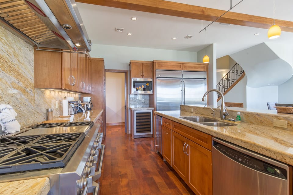 This kitchen is enormous! It is fully stocked with all cooking supplies!