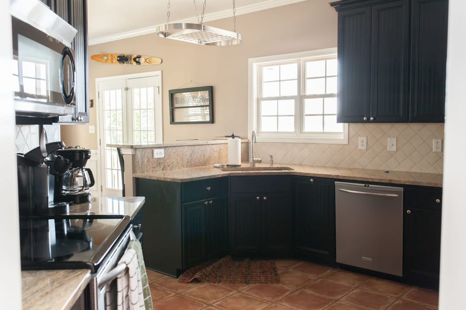 Main level kitchen has regular coffee maker and kcup coffee maker. 