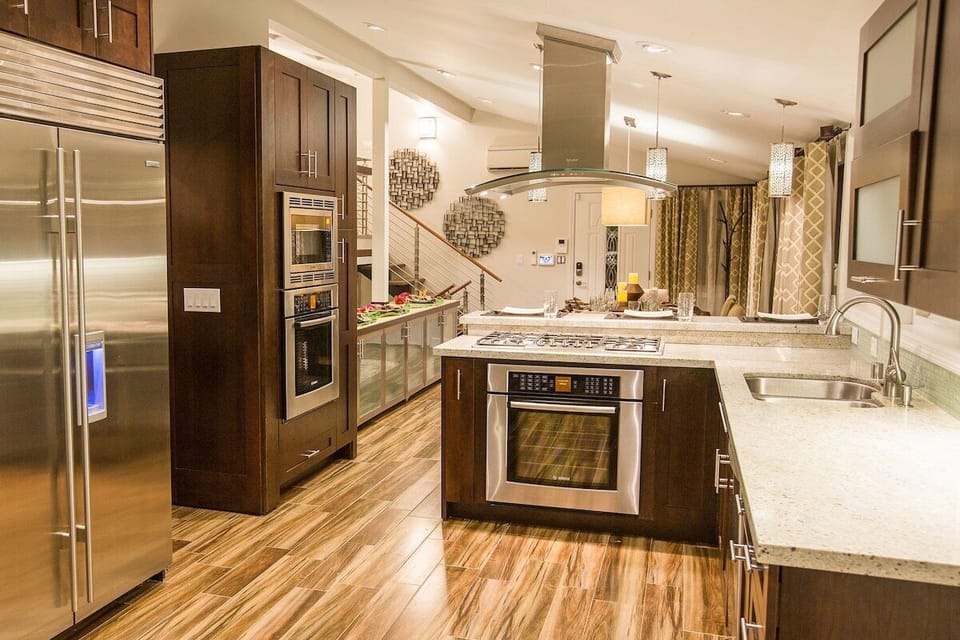 Luxurious kitchen with high end furnishing including Subzero, Miele, Grohe, and Bosch.