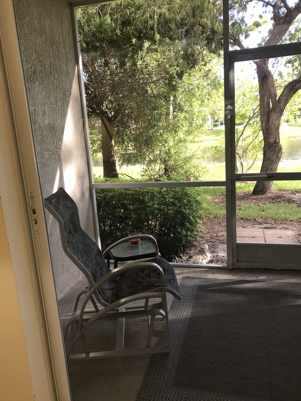 Screened in porch with seating.  Enjoy beautiful evenings outside