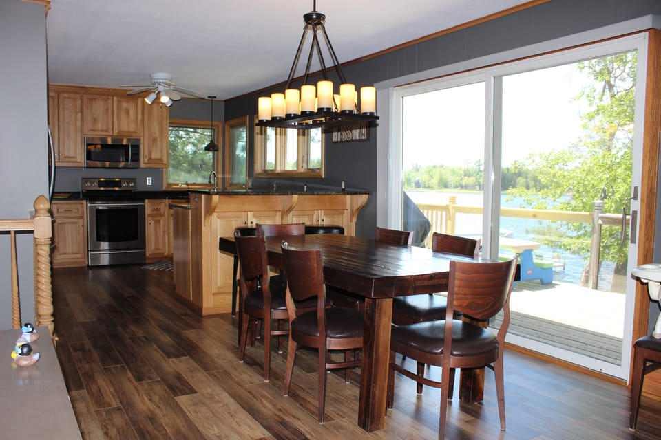 View of kitchen and dining room.  Great view of the lake from every window