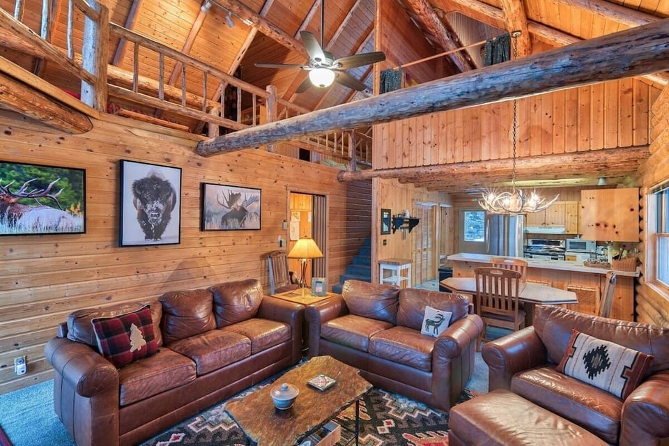 You'll love the rustic feel of the living area, which features vaulted ceilings, beautiful exposed beams, and comfortable furniture.
