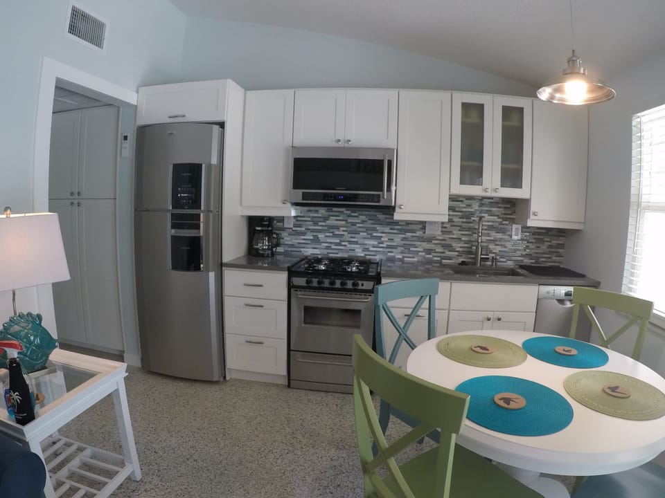 Dishwasher, full size refrigerator  with ice maker, ducted range hood microwave.