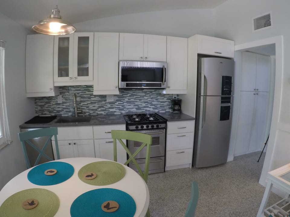 Natural gas range, ducted range hood microwave.