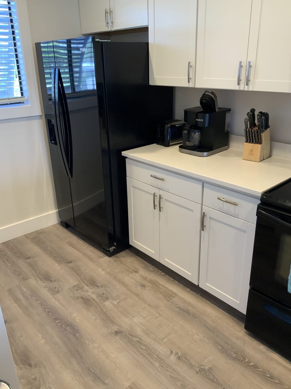 white cabinets / quartz counter tops / LVP flooring