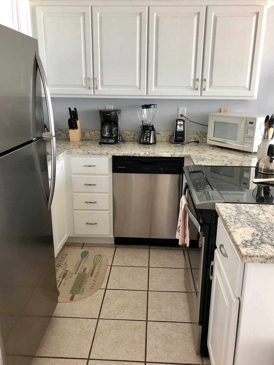 Fully stocked kitchen with stainless steel appliances