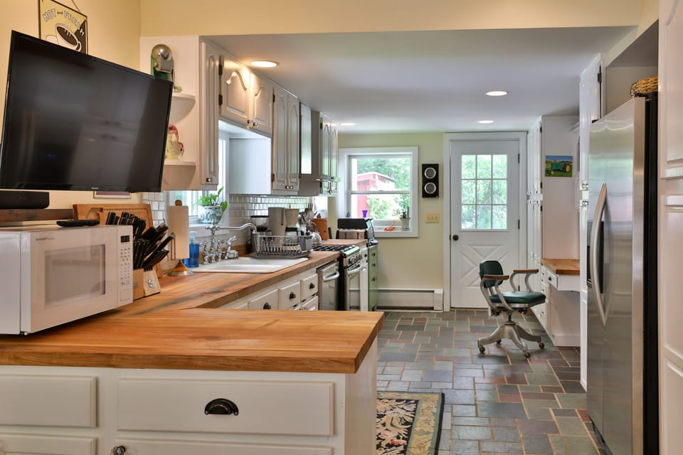 Rock Maple countertops and KitchenAid refrigerator with through-the-door ice
