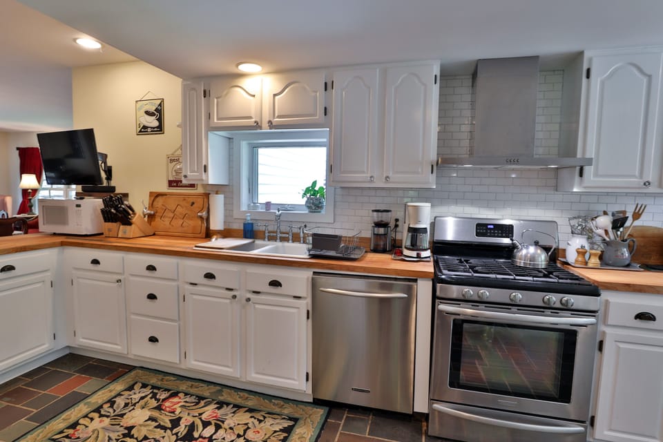 KitchenAid appliances and great double sink.  TV swivels to kitchen/dining room