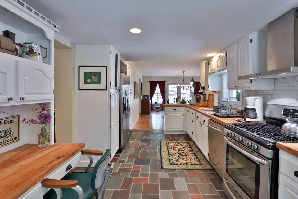 Long view of the kitchen with desk on the left