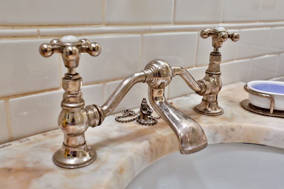 Beautiful, functional hardware on antique sink from turn of the century