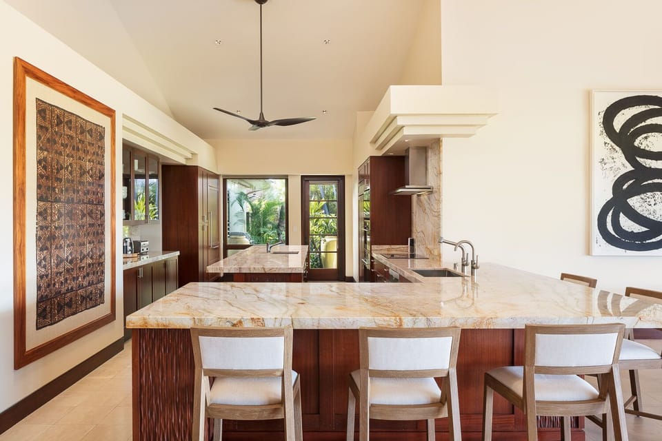 KITCHEN WITH BAR SEATING FOR SIX.  BEAUTIFUL GRANITE COUNTERTOPS.