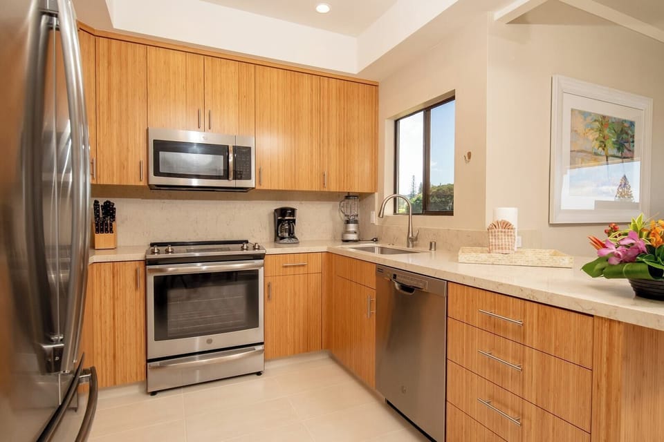 A clean, contemporary space with natural tones and pro-level tools—ideal for cooking or simply enjoying the view