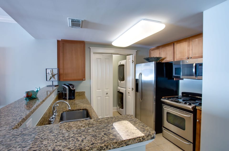 Kitchen is fully equipped with SS Appliances, Granite Countertops, a Keurig, and everything needed for a feast.  Condo also has a large capacity W/D.