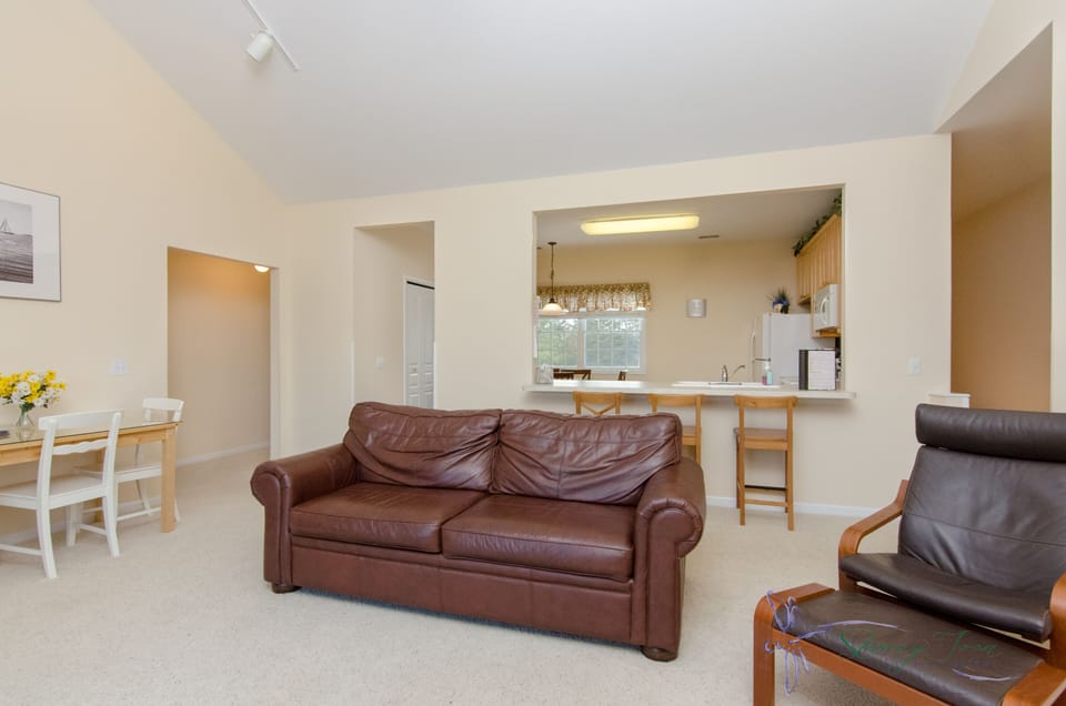 Living room sleeper sofa, fire place, tv, table seats 3 or 4 2 chairs, balcony 