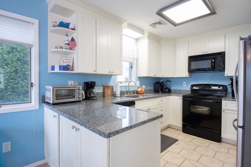 Kitchen was updated in 2019. Repainted 2023 to lighter blue than seen here