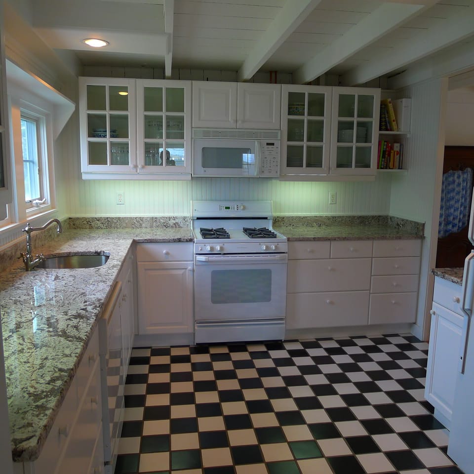 Granite countertops in this pretty, functional kitchen.