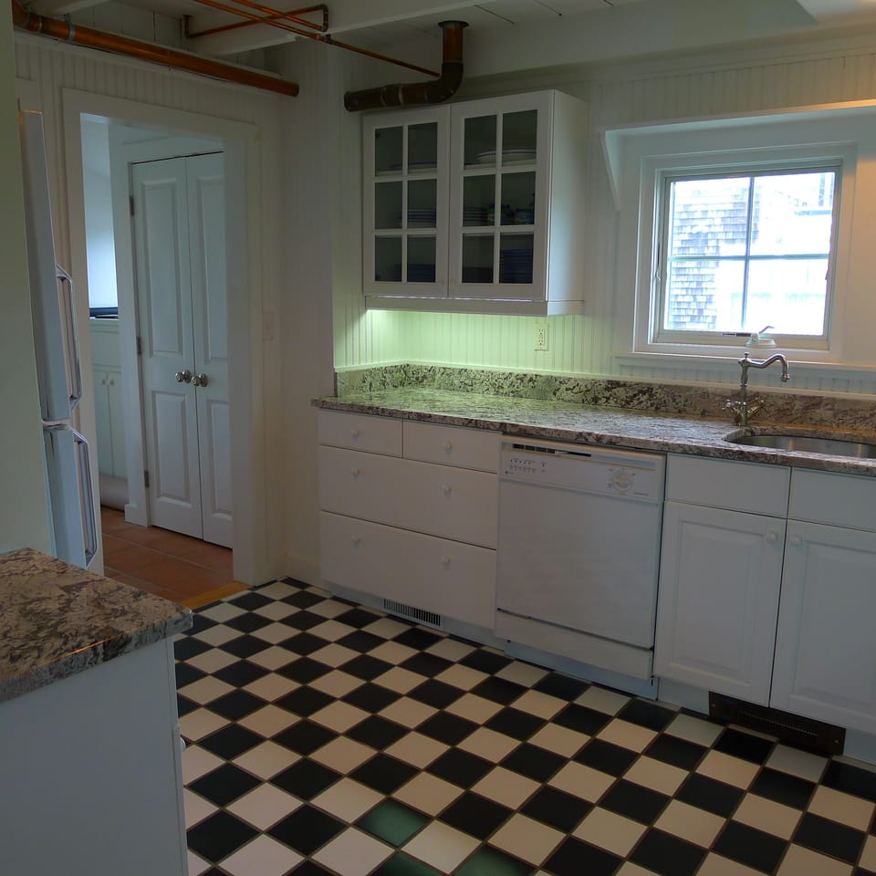 From the kitchen, it's through the mudroom and onto the deck.