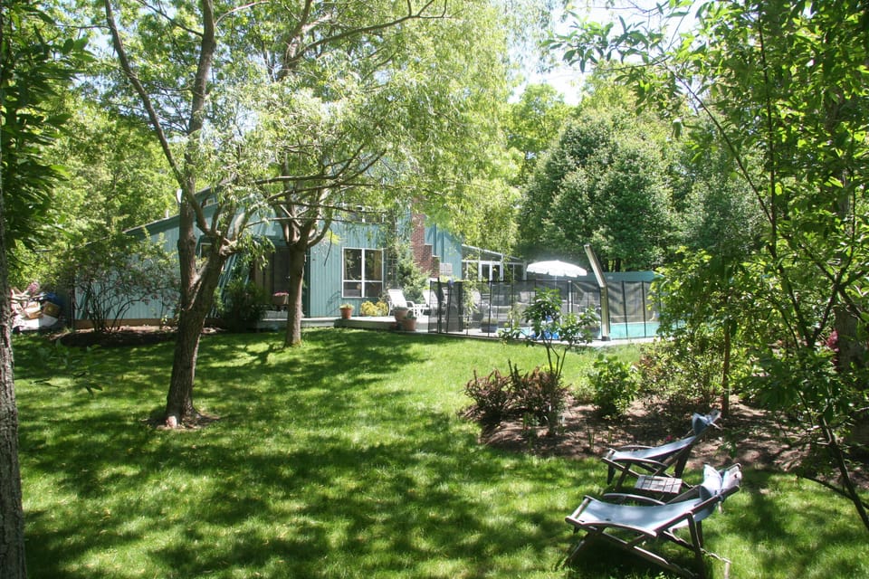 Garden and pool (tennis court behind photographer)