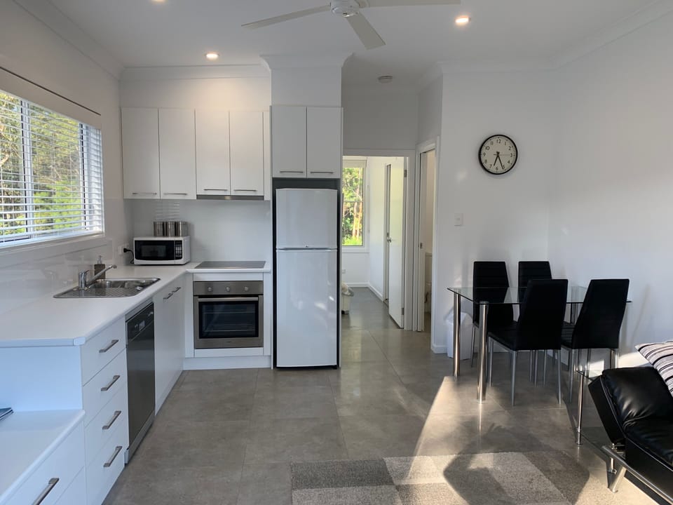 full kitchen and dining in living area