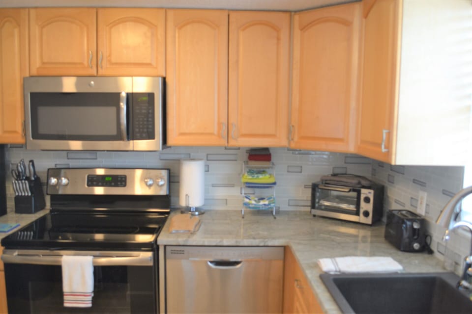 Kitchen, refrigerator, microwave, dishwasher, toaster oven, coffee maker, etc.