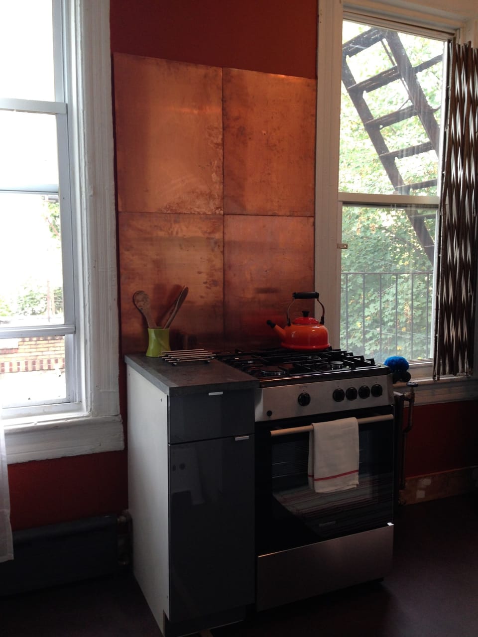 Warmth in Kitchen accented with copper back splash.
