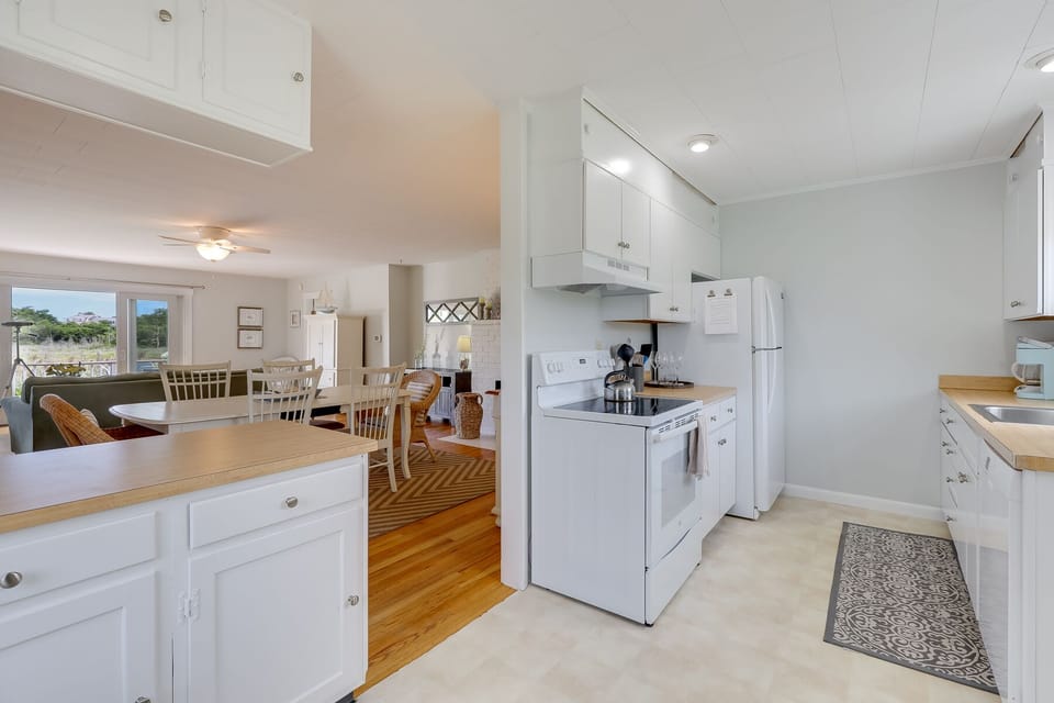 Nicely equipped kitchen open to dining