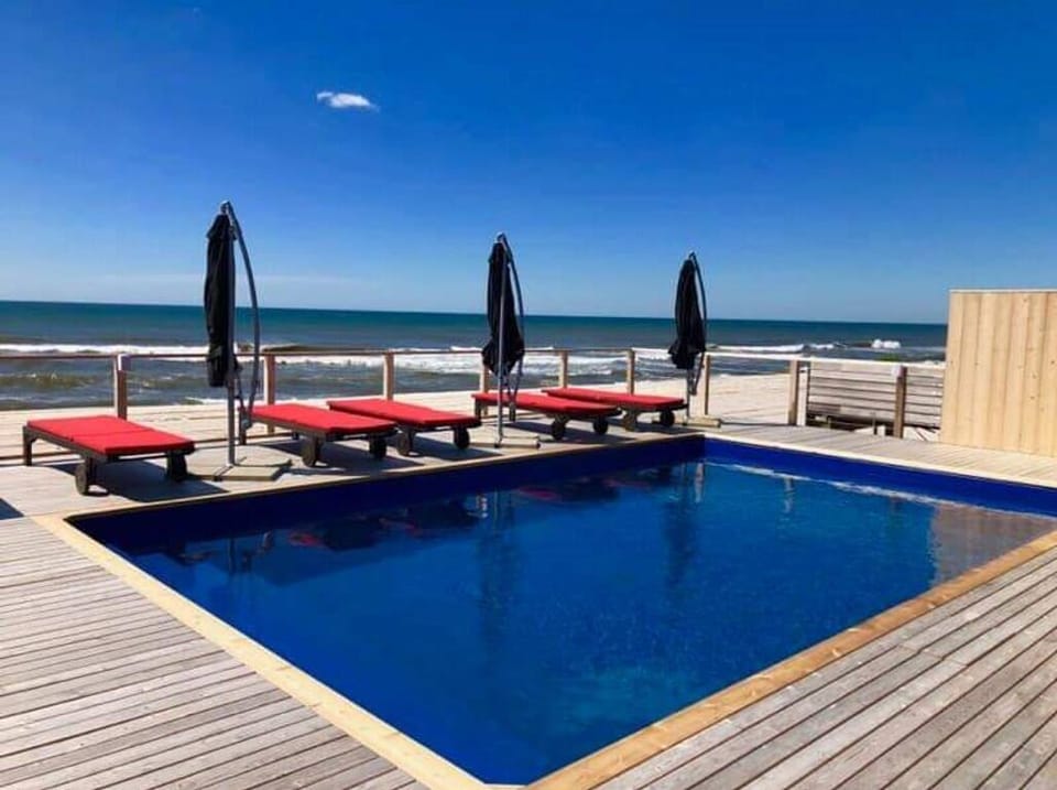 The pool features a wraparound bench for maximum relaxation