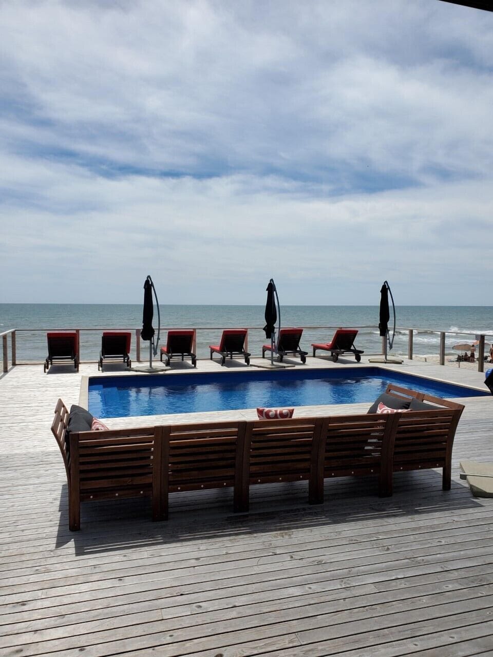 The social center of the house is the oceanfront deck