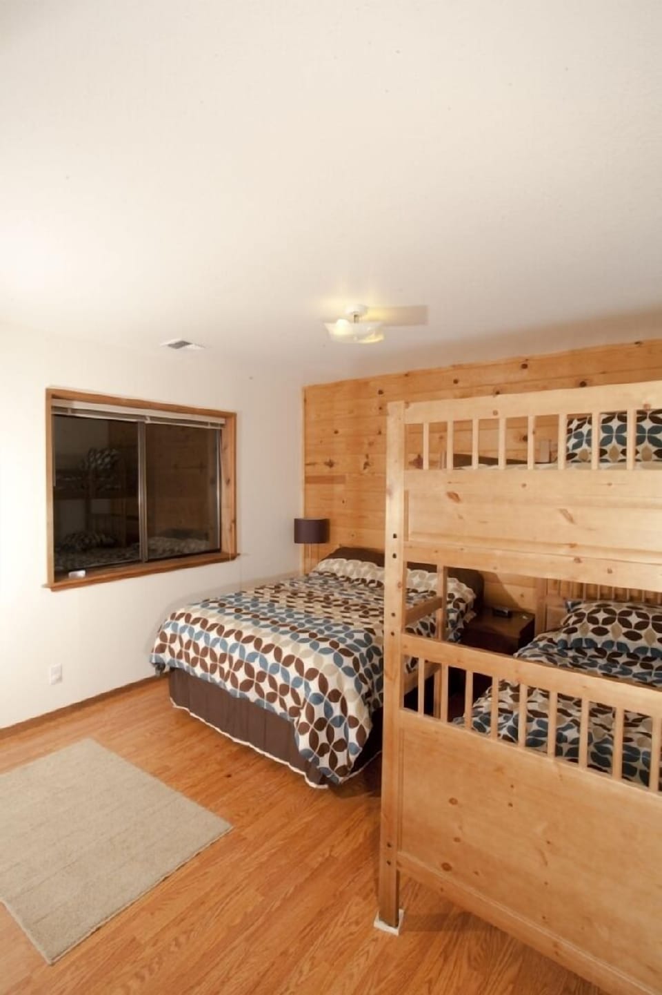 The left bedroom has a double bed and bunks
