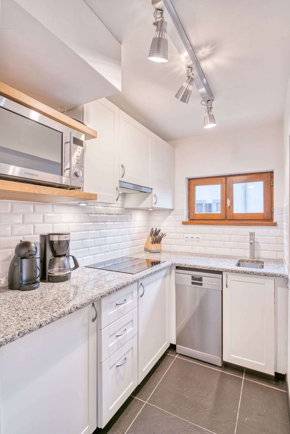 Brand new kitchen with induction top, dishwasher, microwave oven, toaster etc.
