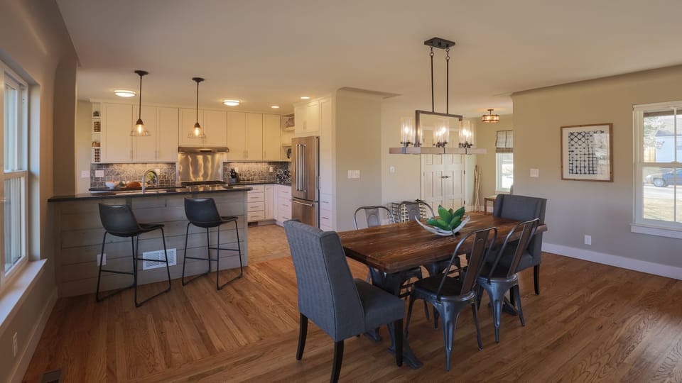 Dining, breakfast bar, kitchen, and entry