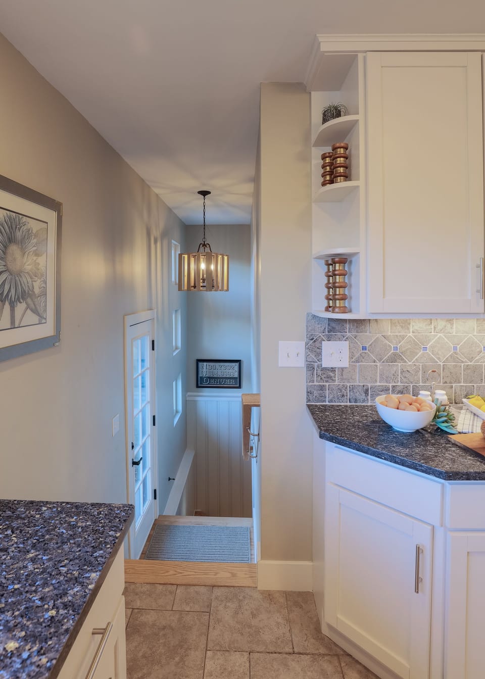 Stairway to garden level, backyard, and detached garage