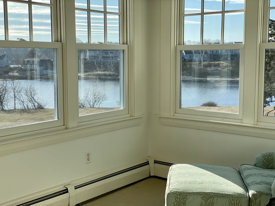Master suite sitting nook looking out at beach and harbor 