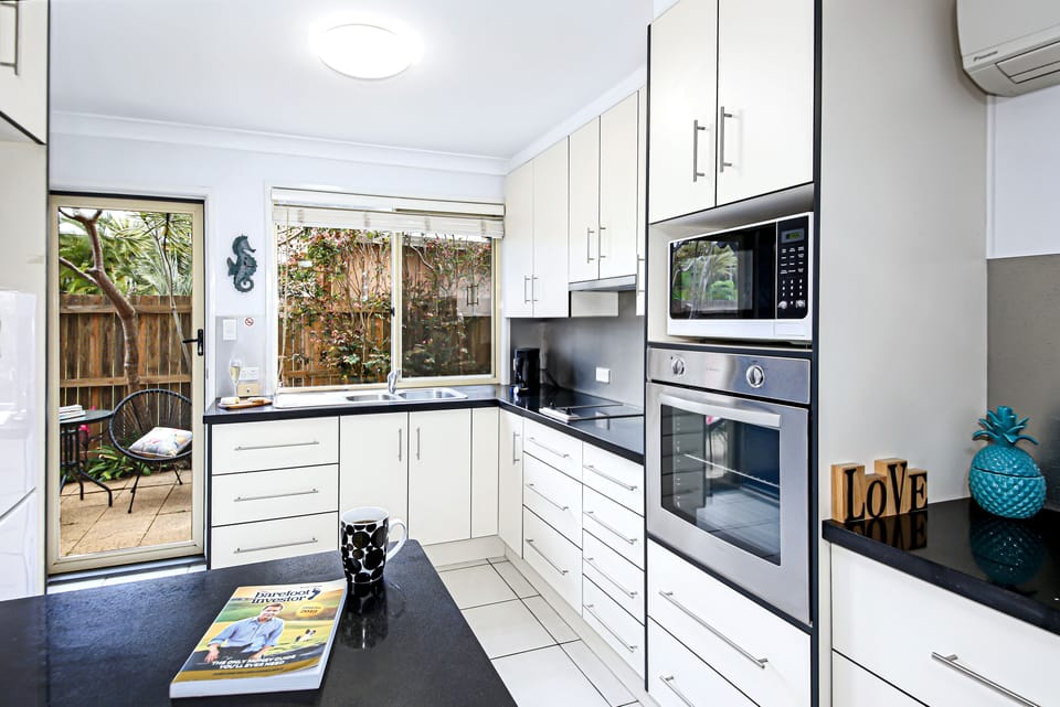 large fully equipped kitchen with coffee pod machine microwave full oven 
