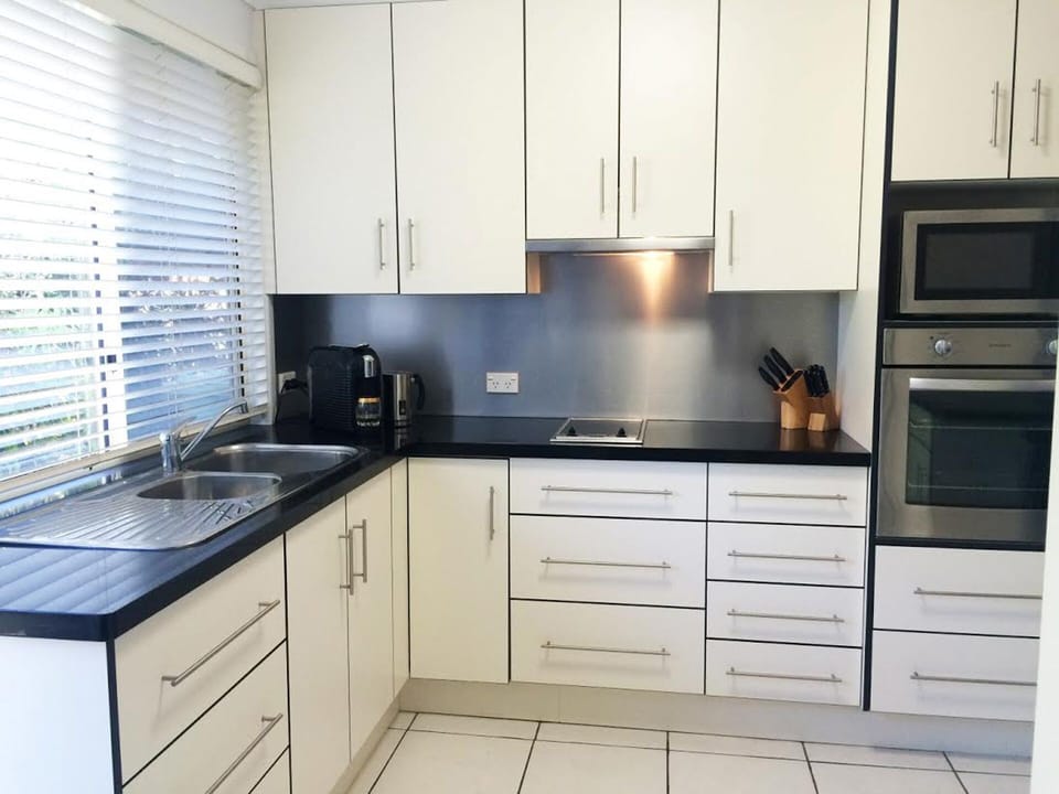 Well  Equipped kitchen with basic pantry items. Microwave cook top oven Pod Coff