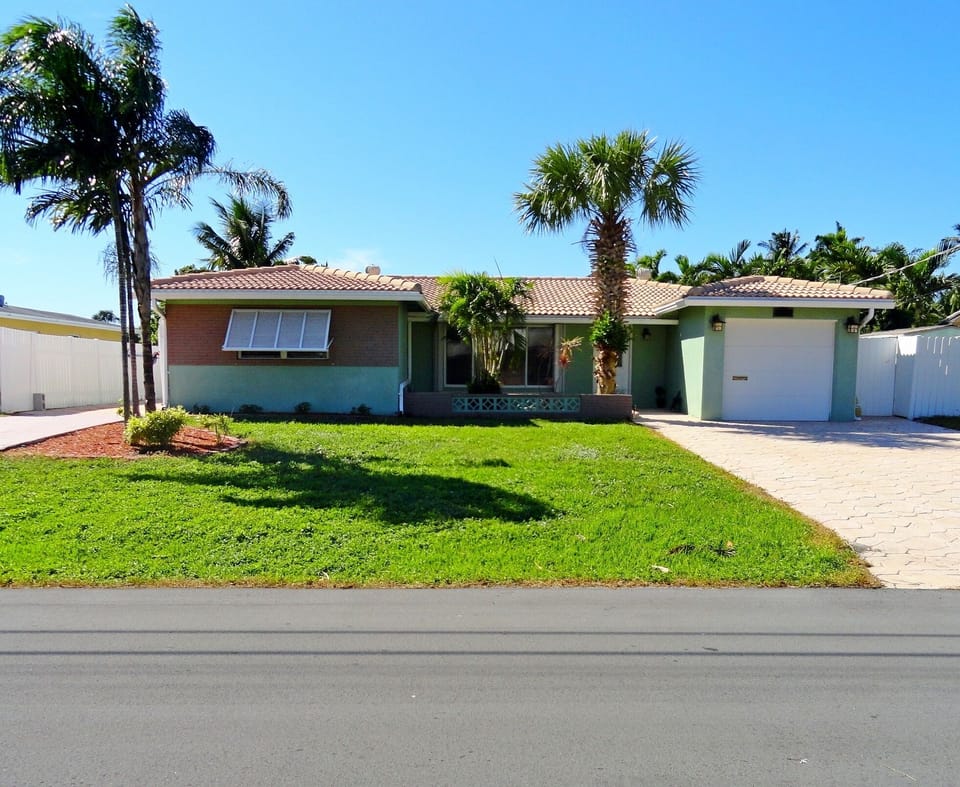 Front house, stamped driveway, second driveway (Left) with room for RV/Boat